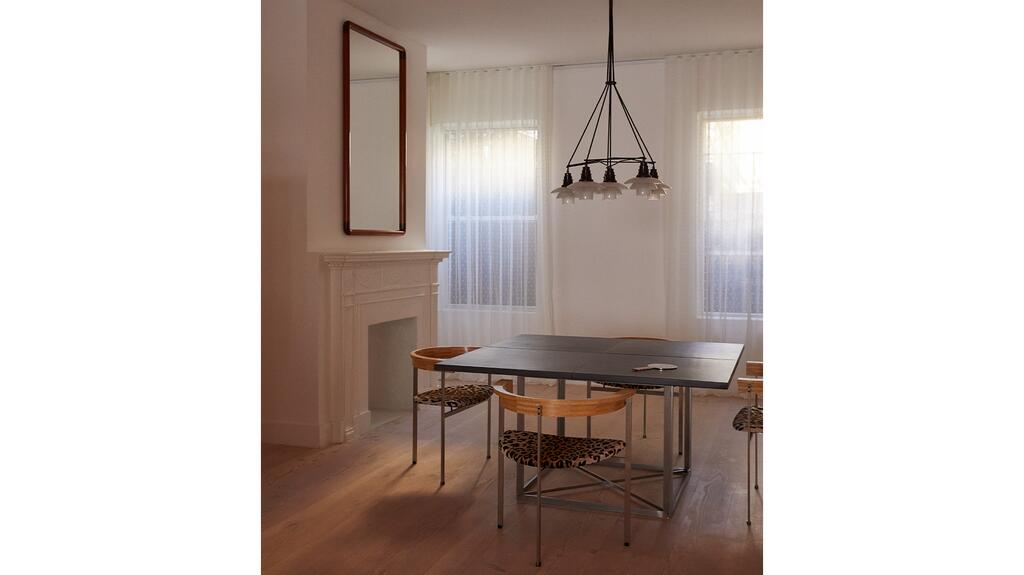 The new location tells the story of Sophie Bille Brahe as an extension of her universe, explained the brand. This area references her office in Copenhagen with the worktable and chairs from Poul Kjærholm and a “Star-Crown” lamp by Poul Henningsen. Sophie Bille Brahe NYC Store Interior